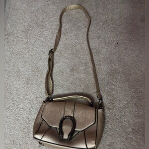 Metallic Gold faux leather handbag with a snakeskin design #leatherhandbag